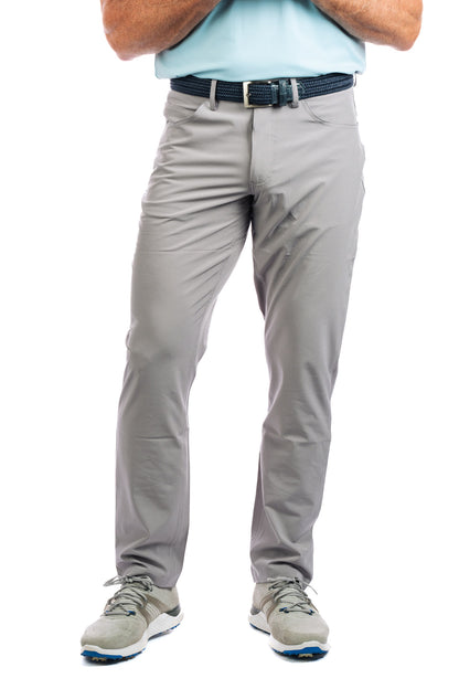 Half body shot of our Concrete golf pants on a model from the front. 