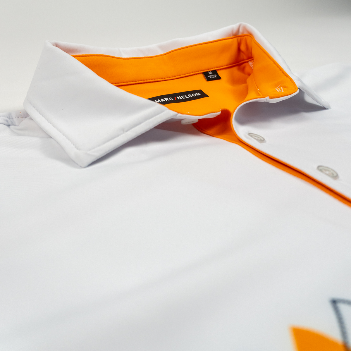 Orange Argyle Performance Polo