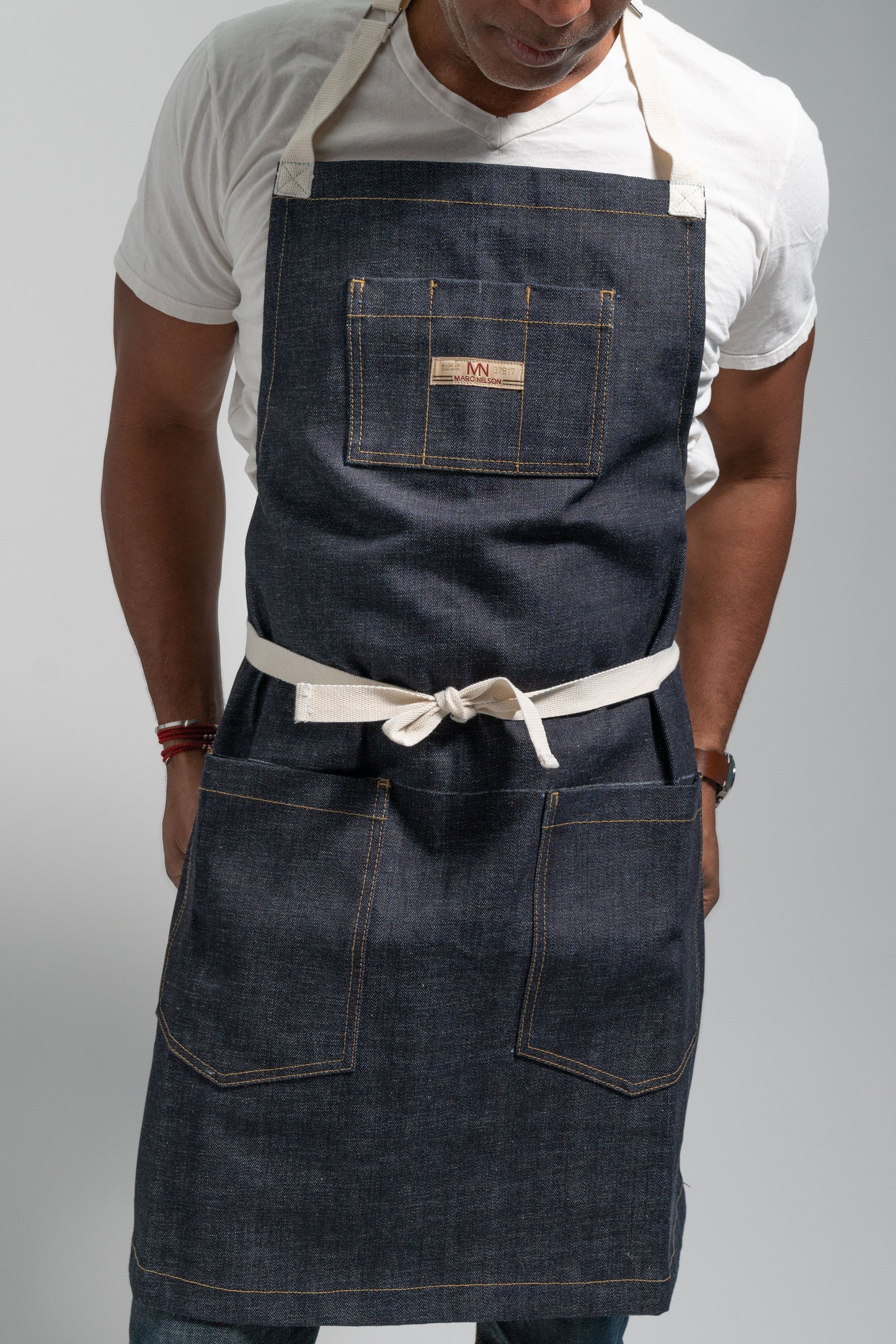 Photo of a model wearing the Common Apron in Indigo.