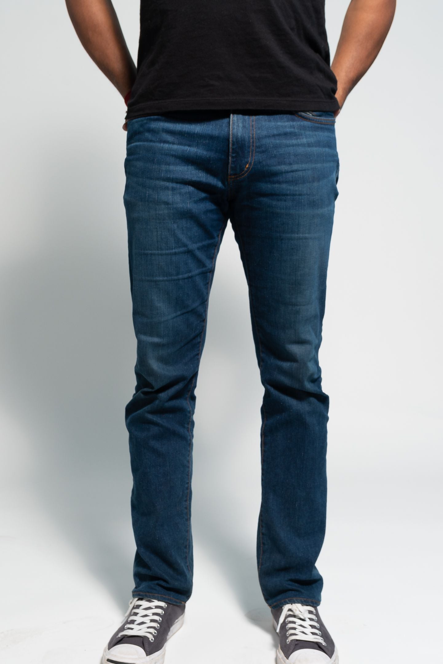 Photo of model wearing Nelson Medium Wash Denim on white background