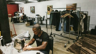  Founder Marcus Hall working with denim in the flagship store based in Knoxville, Tennessee