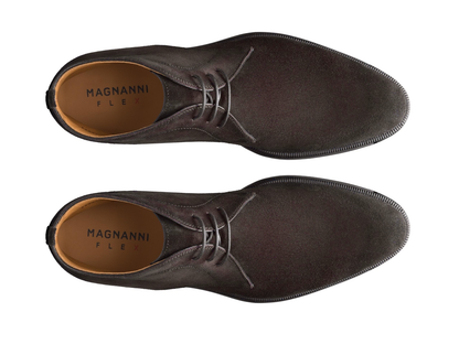 A pair of brown suede Magnanni shoes on a white background, top view.