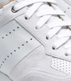 Pair of men's white leather Magnanni Sona sneakers on a white background, close up of details.