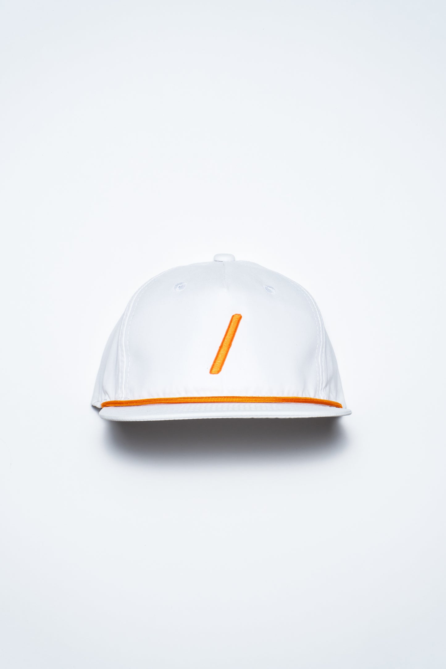 A white baseball cap with an orange vertical line on the front and an orange stripe along the edge of the brim, displayed against a plain white background.