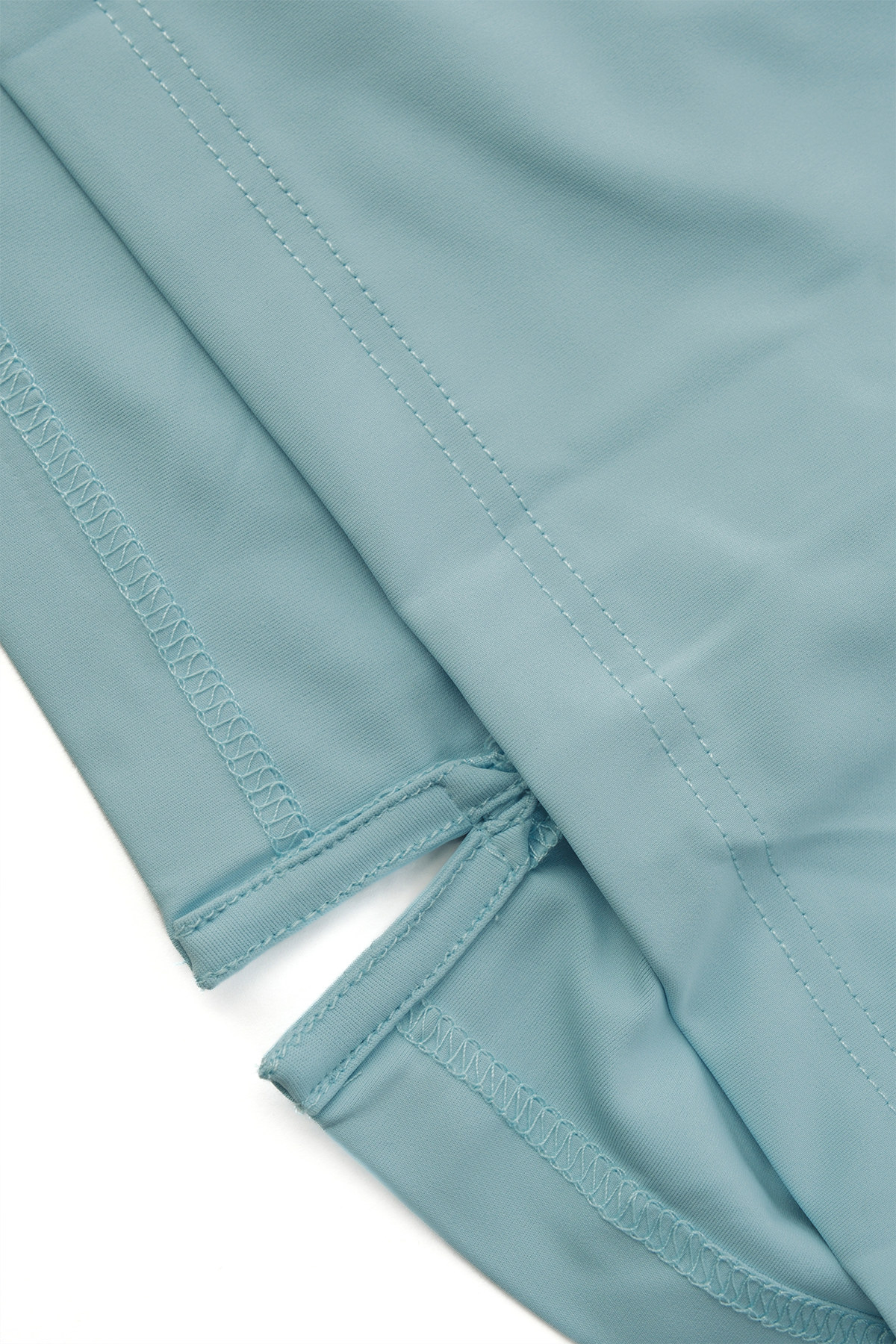 Close up of the details on Light blue golf polo.