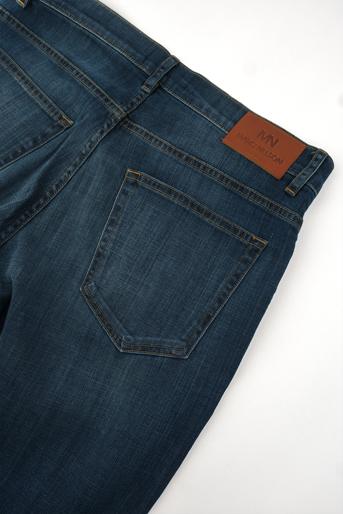 Close up photo of the backside of our medium wash denim. 