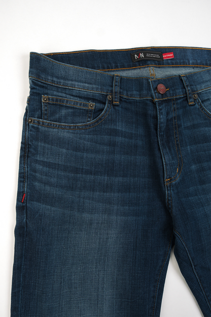 Close up photo of medium wash denim from the thigh up