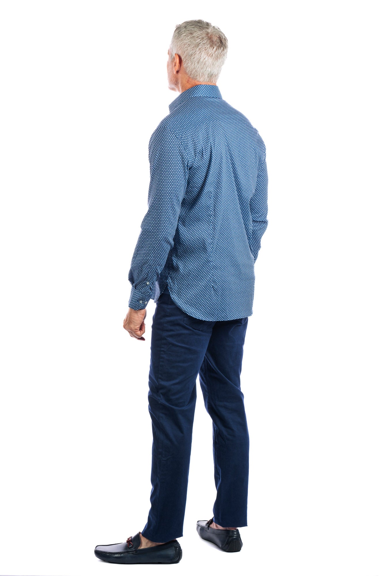 Backside profile photo of model wearing the george navy pants on a white background and looking away from the camera.