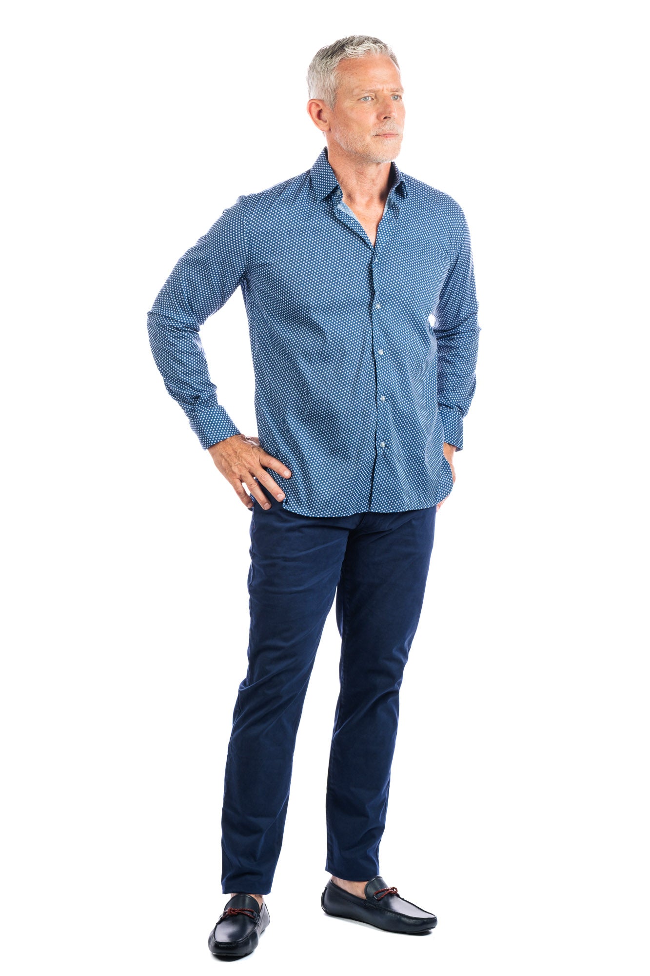 Front profile photo of model wearing the george navy pants on a white background and looking away from the camera.