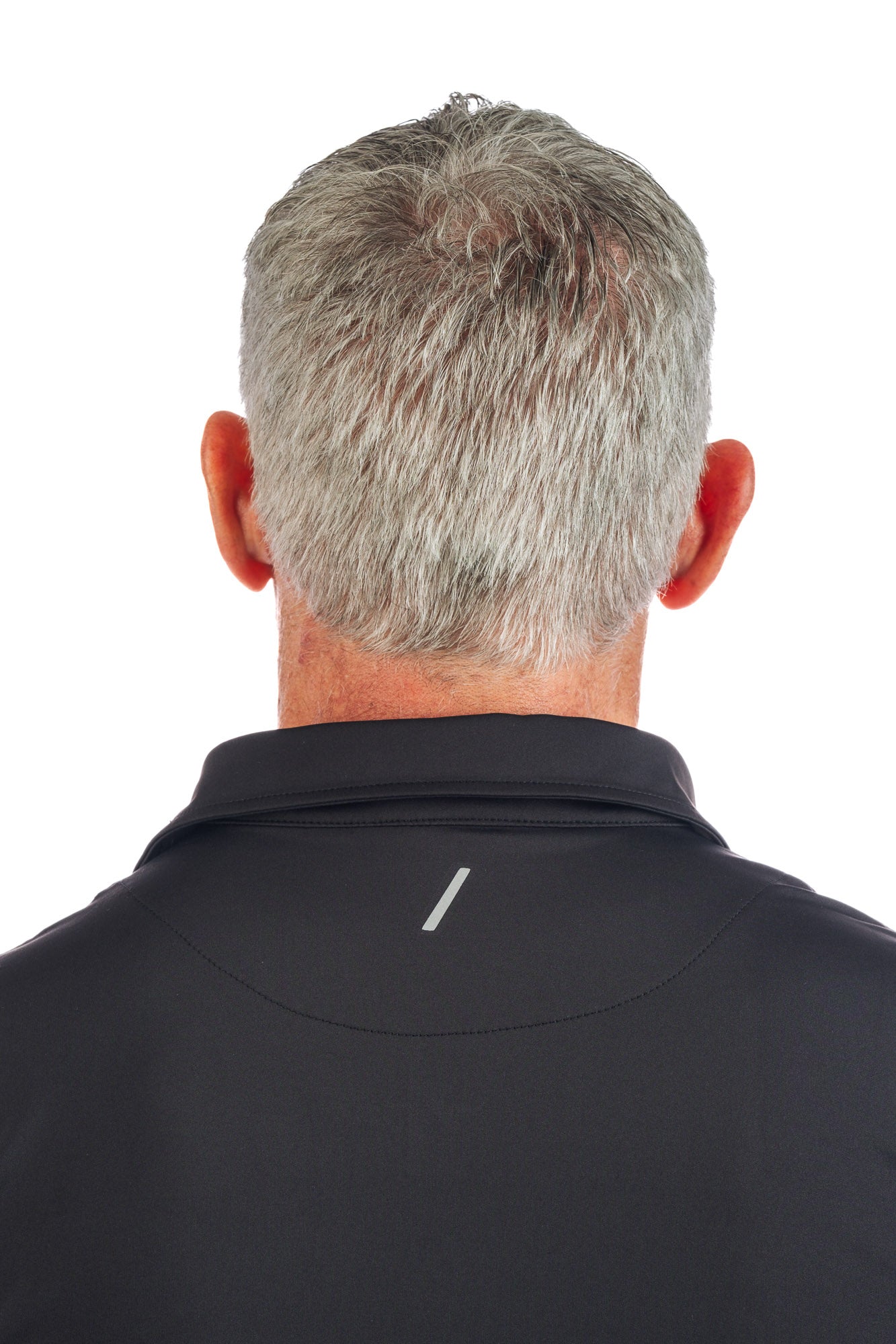 Close up Photo of the backside of model wearing a black golf polo and concrete five pocket pants on a white background.
