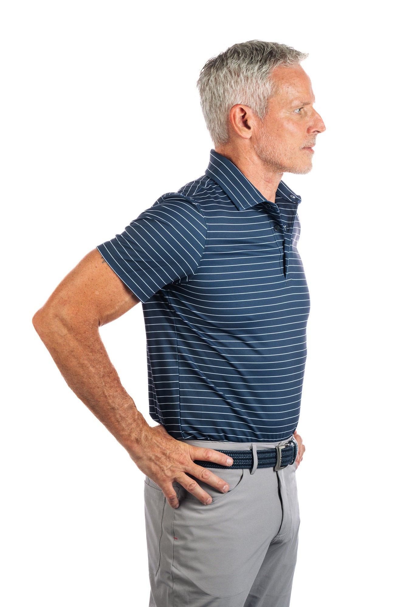 Side profile photo of navy golf polo with white stripes on a white background