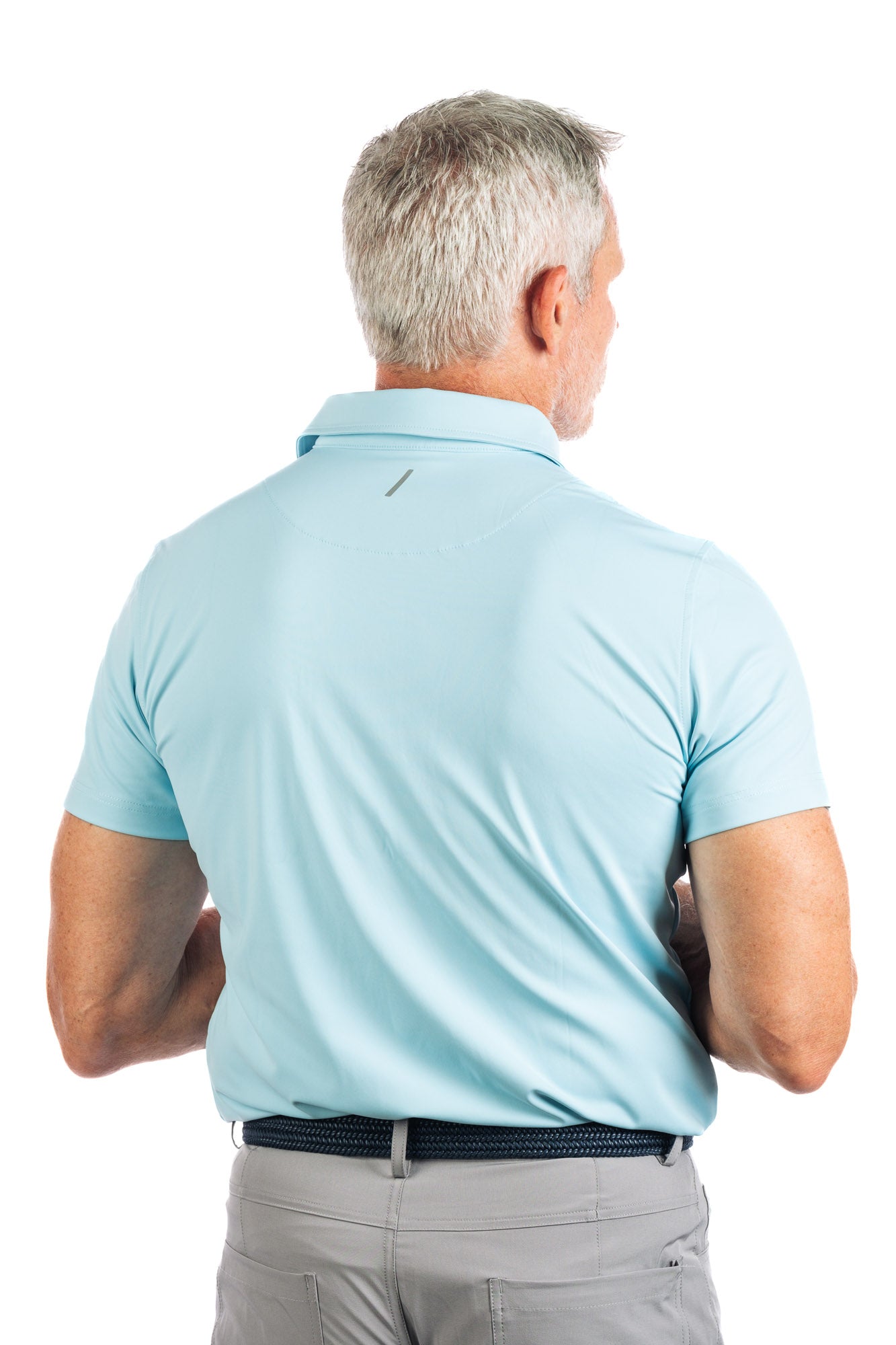 Backside waist up photo of light blue golf polo on white background on a model.