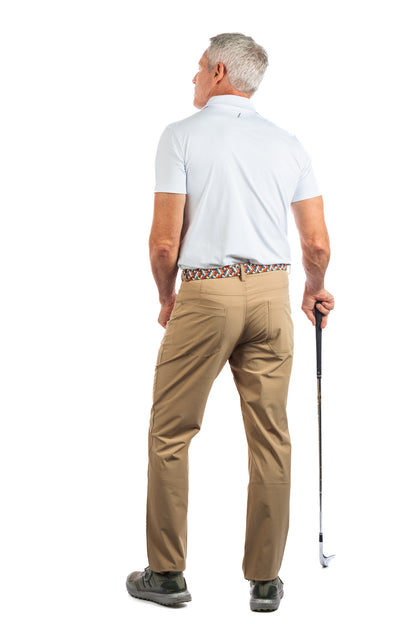 Photo of a model wearing our White Golf Polo on a White Background showing the backside of our model.
