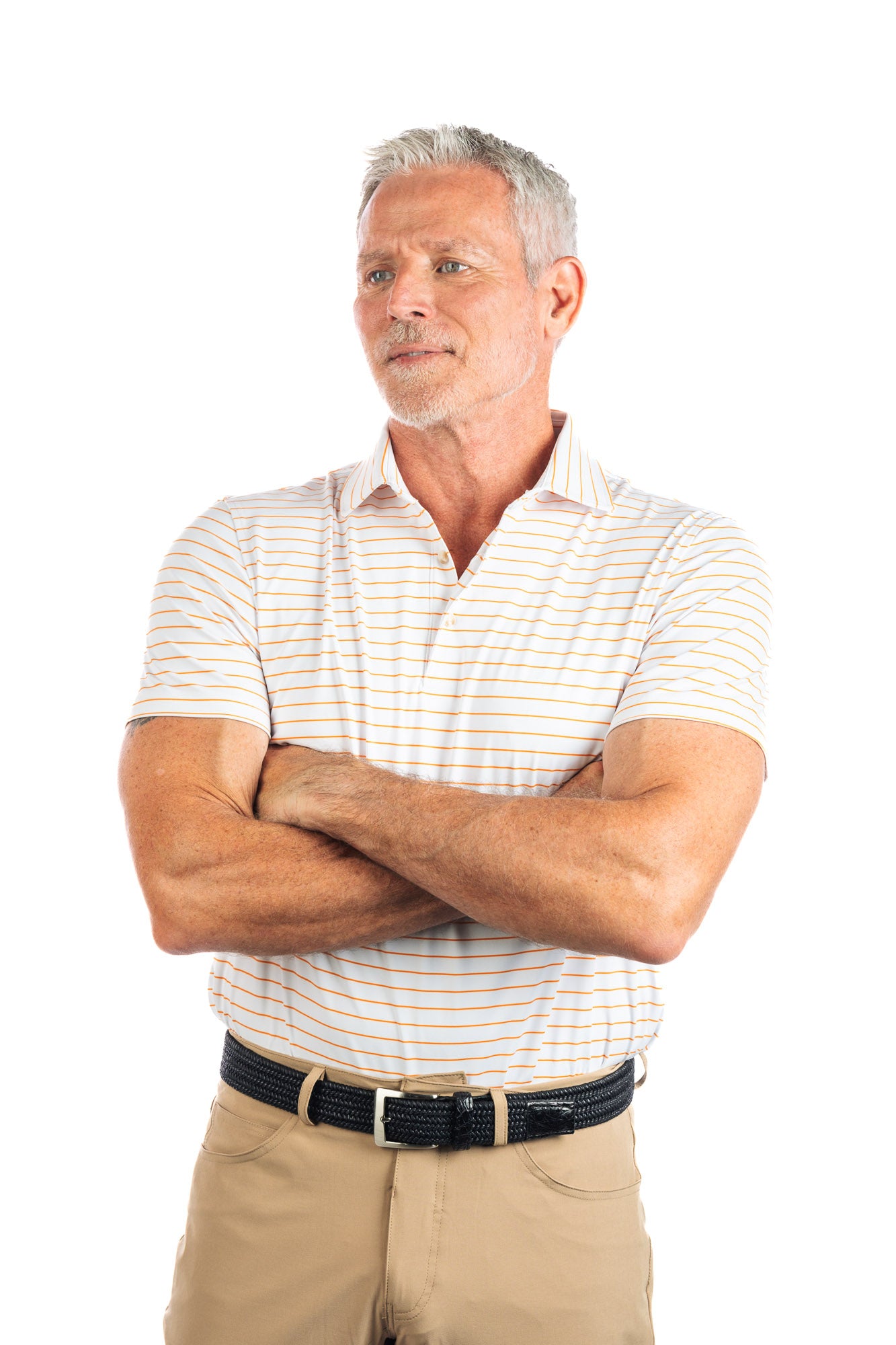 Waist up photo of model wearing the Orange striped golf polo on a white background.