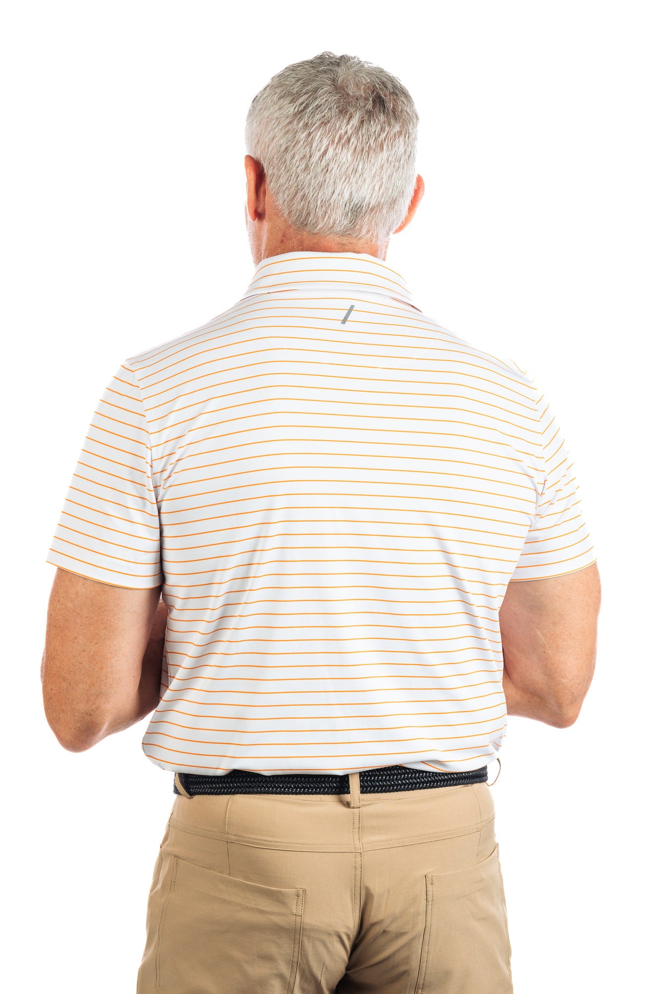 Waist up photo of model wearing the Orange striped golf polo on a white background showing us his back. 