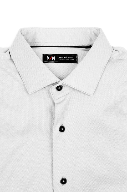 White Marc Nelson knit dress shirt folded on a white background.