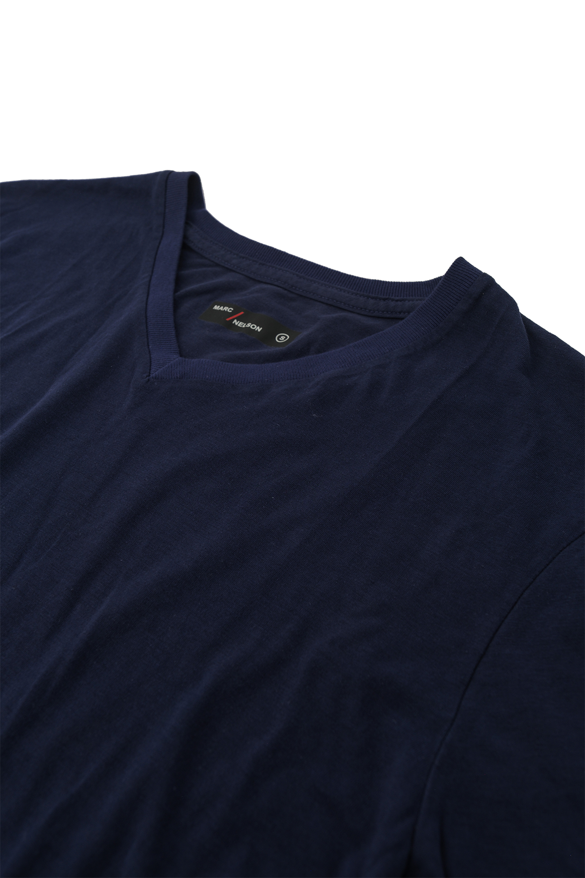 Close up of navy v-neck t-shirt laid flat on a white background.