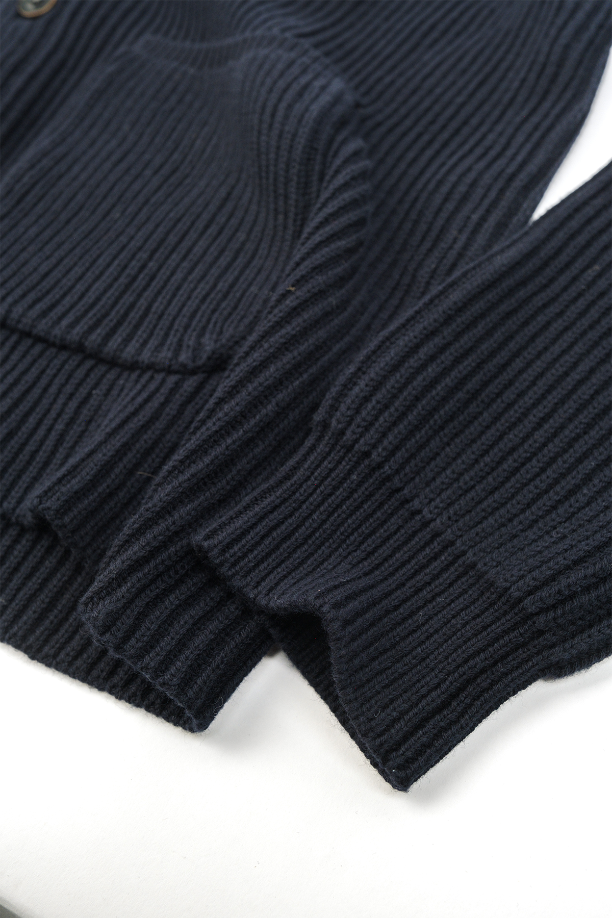Close up photo on the details of the Freddy Cardigan, specifically looking at the sleeves. 