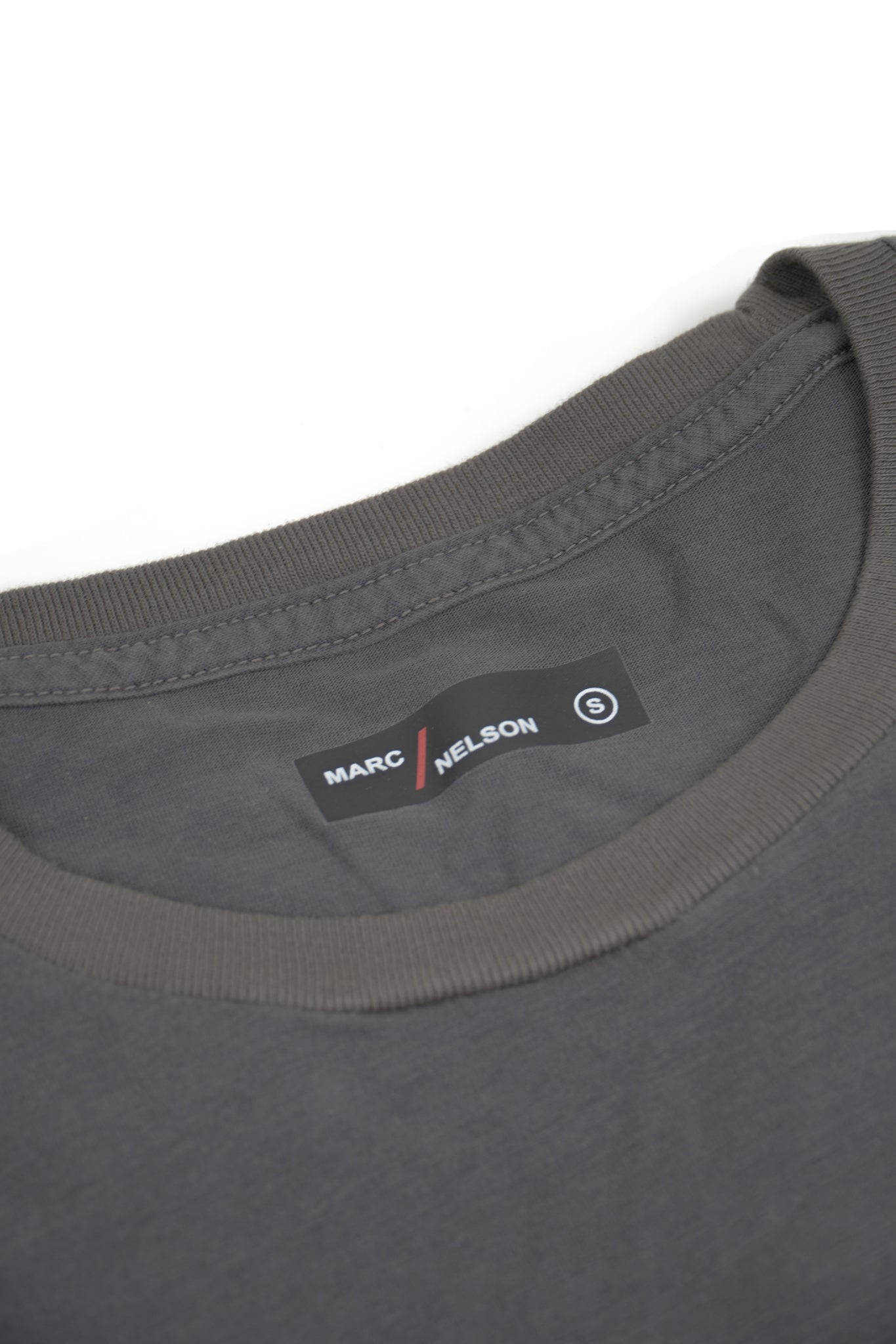 Gray crew neck t-shirt laid out flat on a white background.