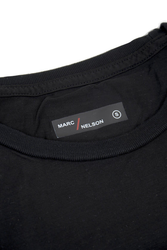 Close up of a black crew neck t-shirt folded on a white background.