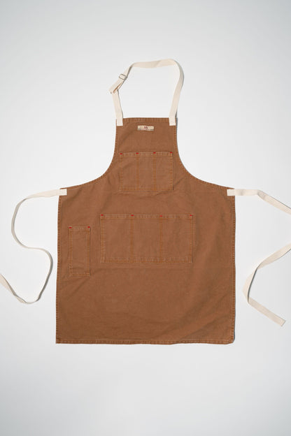 Canvas apron laid out flat on a white background. 